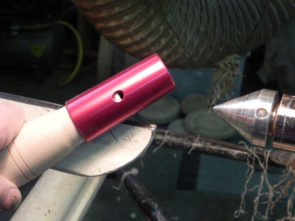 Fitting the ferrule. Note the "viewing hole" for checking the position of the handle in the ferrule.