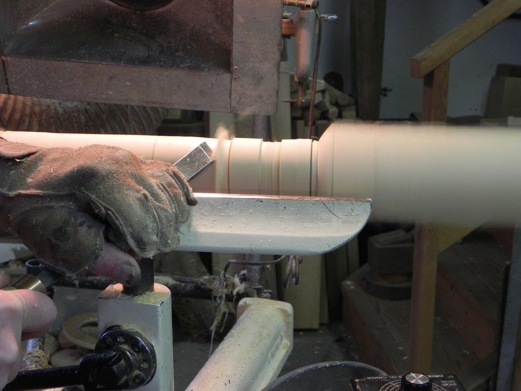 Turning the top of the cylinder.