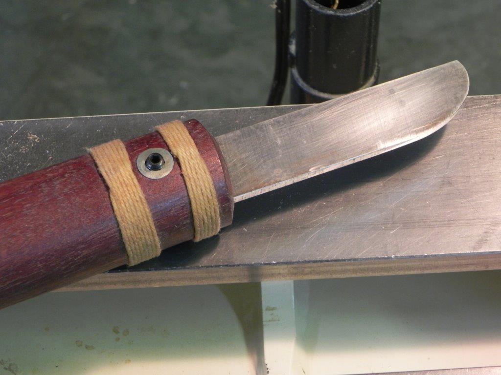 String ferrule on an oval handle. Note ends drawn and secured under  the whipping.