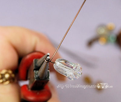 Bring the free end of the wire around the jaw of the pliers