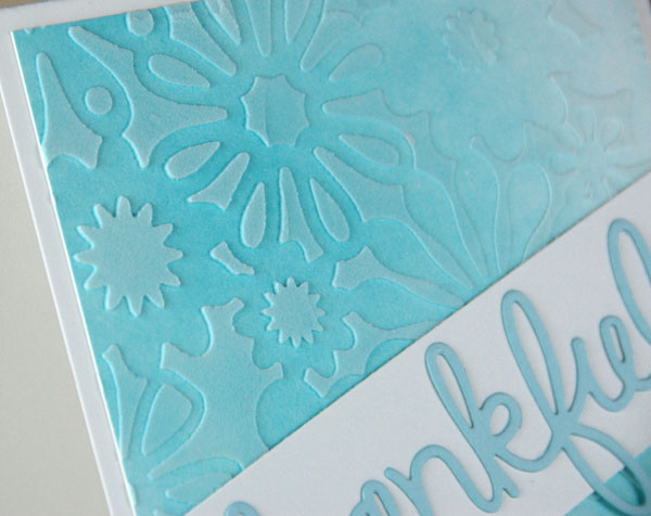 Close up of stencil on gradient blue