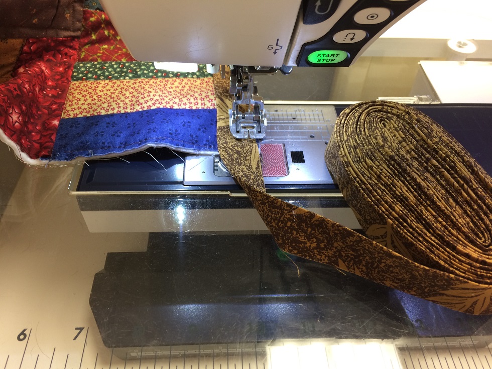 binding rolled up and ready to sew