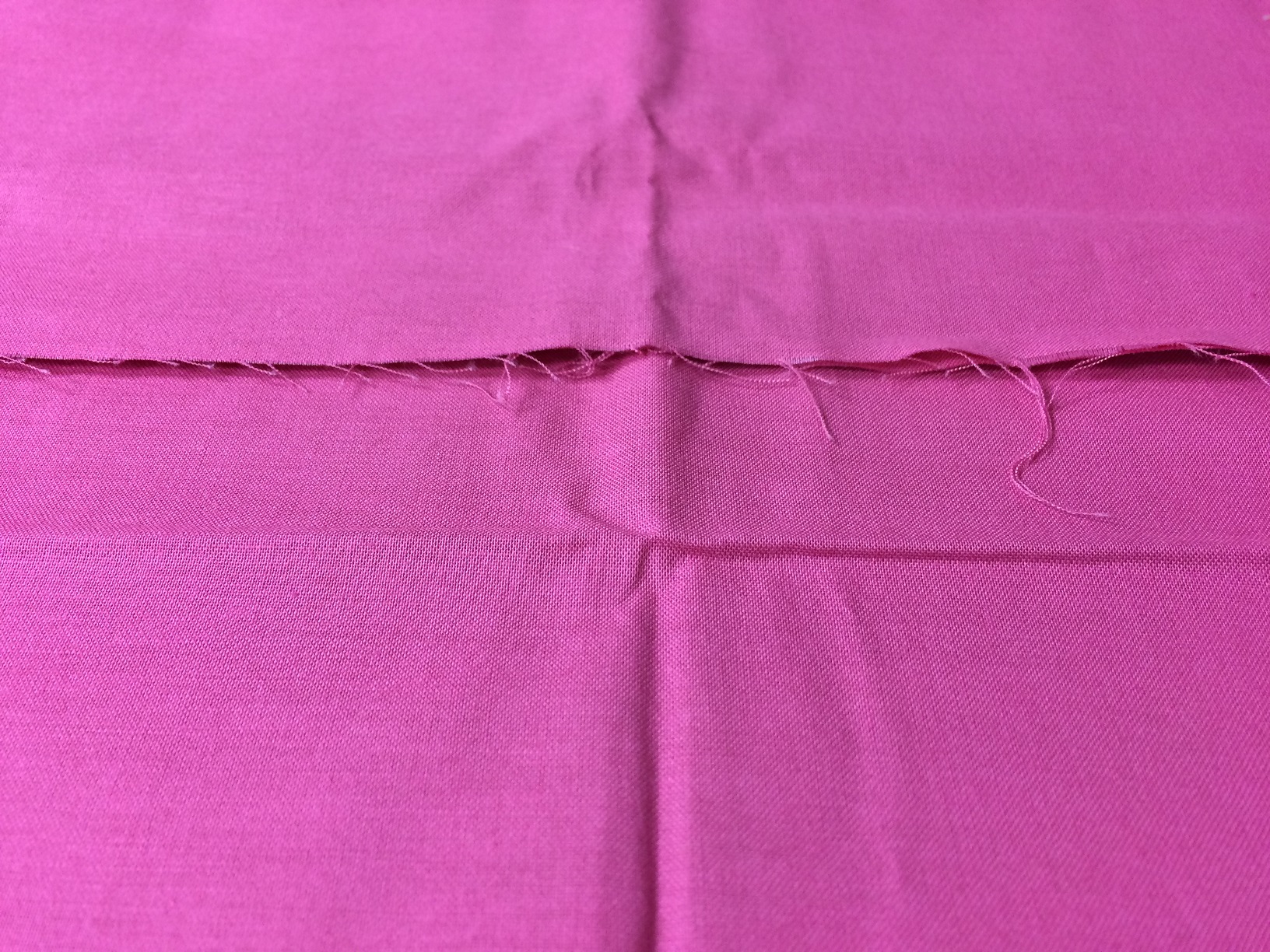 creased fabric yardage