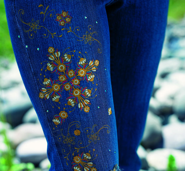 Bright threads embroidered on denim.