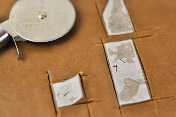 Cutting out a gingerbread house template by Juniper Cakery