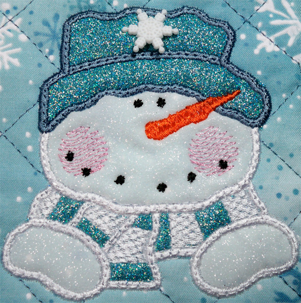 Applique snowman mug rug with glitter flex vinyl.