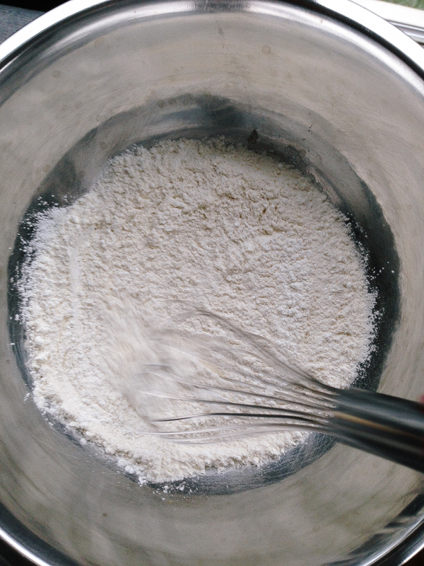 Whisking all-purpose flour to make cake flour