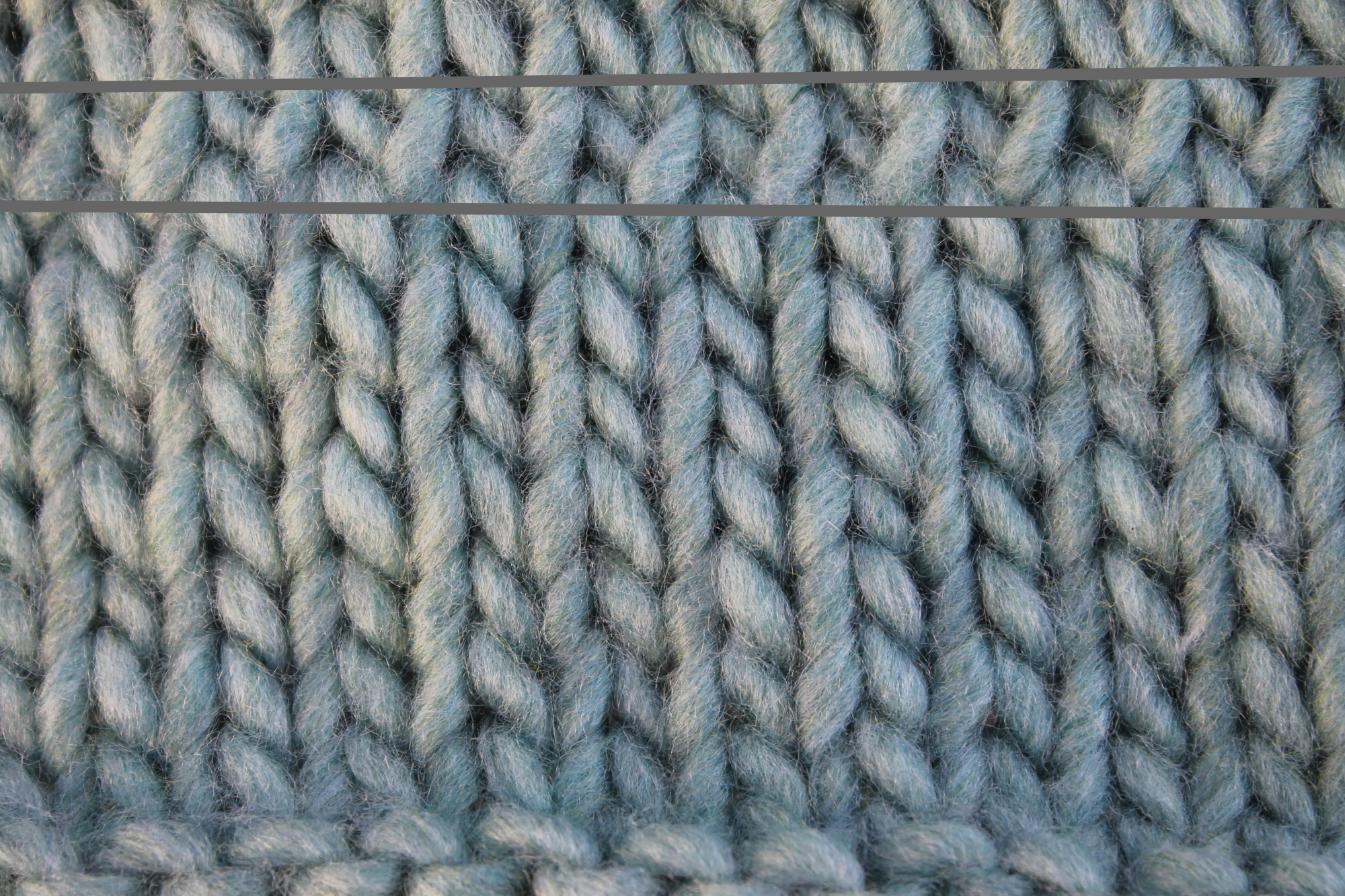 Close up of stitches mounted wrong way in the row