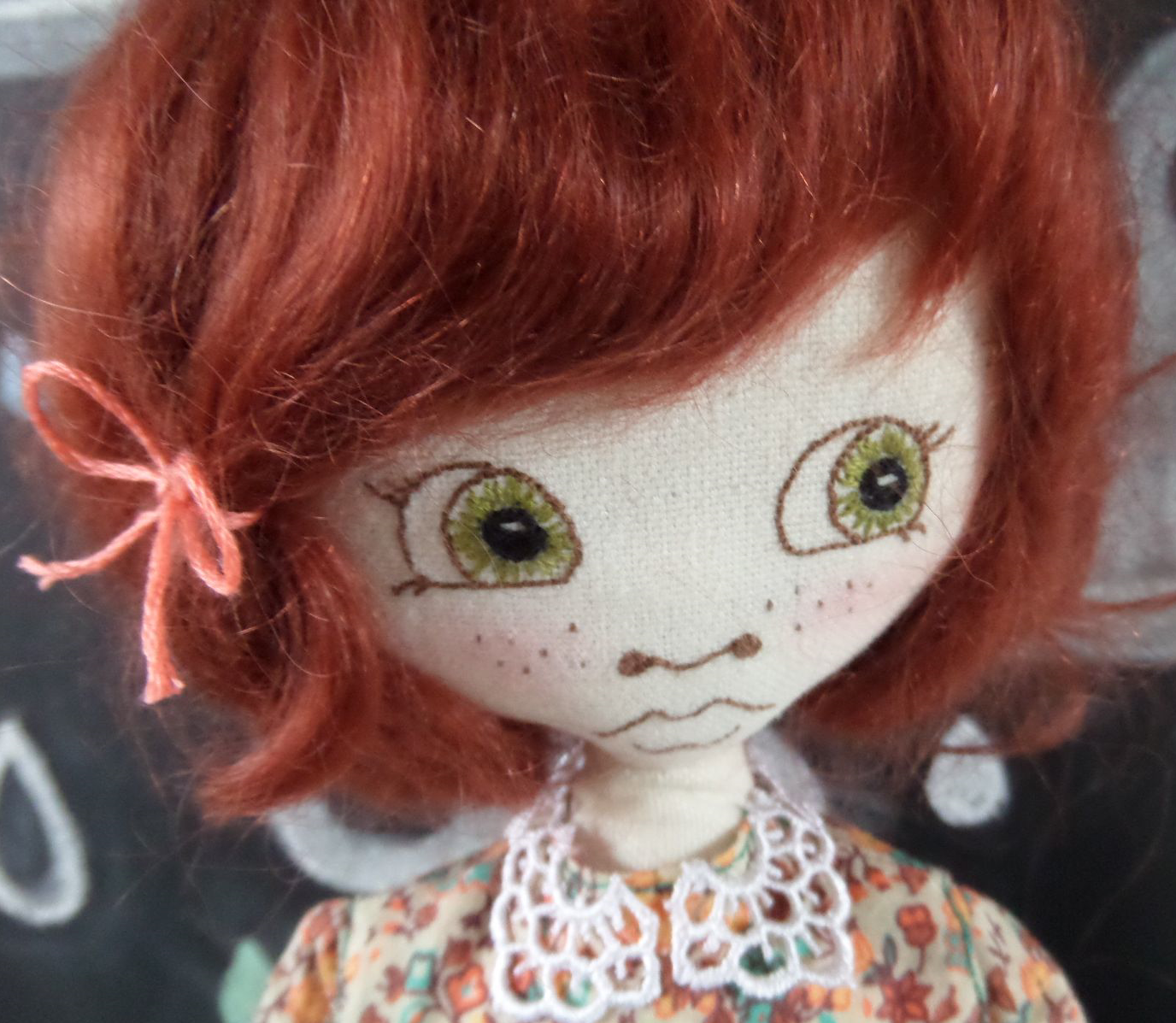 Beautiful hand embroidered eyes on this stunning doll by Supercutetilly