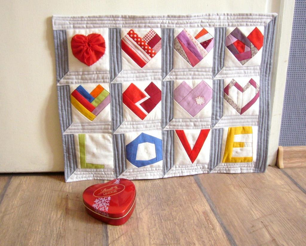 Paper pieced Valentine LOVE hearts quilt