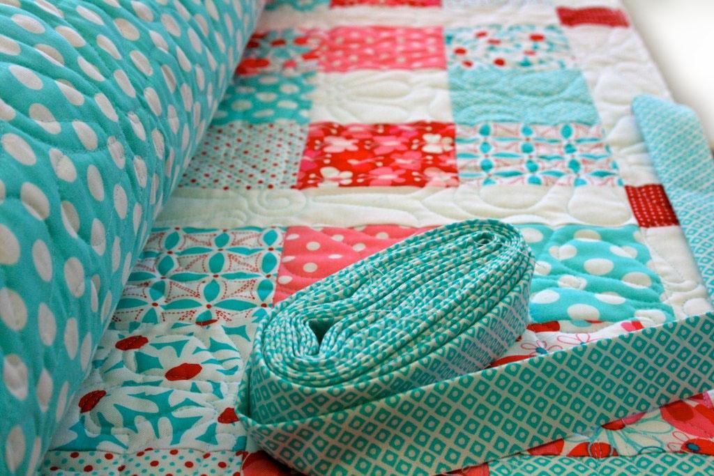 red, pink and aqua 9-patch quilt pattern here