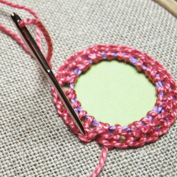 Pull the working thread through behind this chain stitch