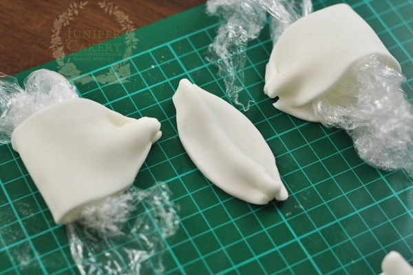 putting together the white fondant bow