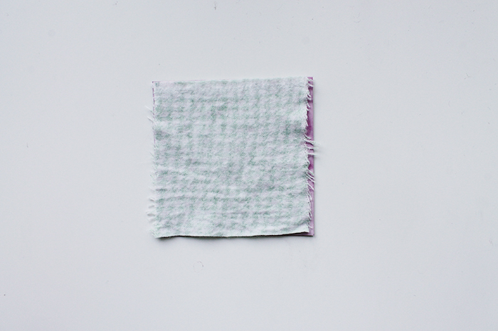Fabric swatch after shrinking, over template