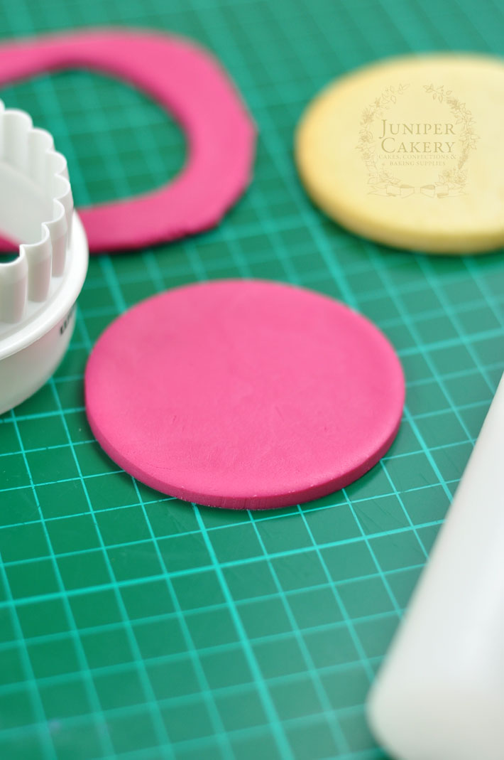 cutting rolled fondant for sugar cookies