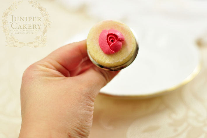 Pipe royal icing rosettes onto sugar cookies