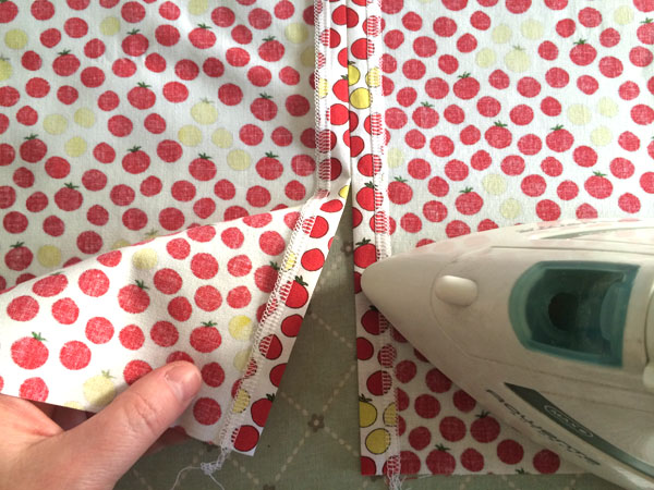 press the seam allowance open to hem