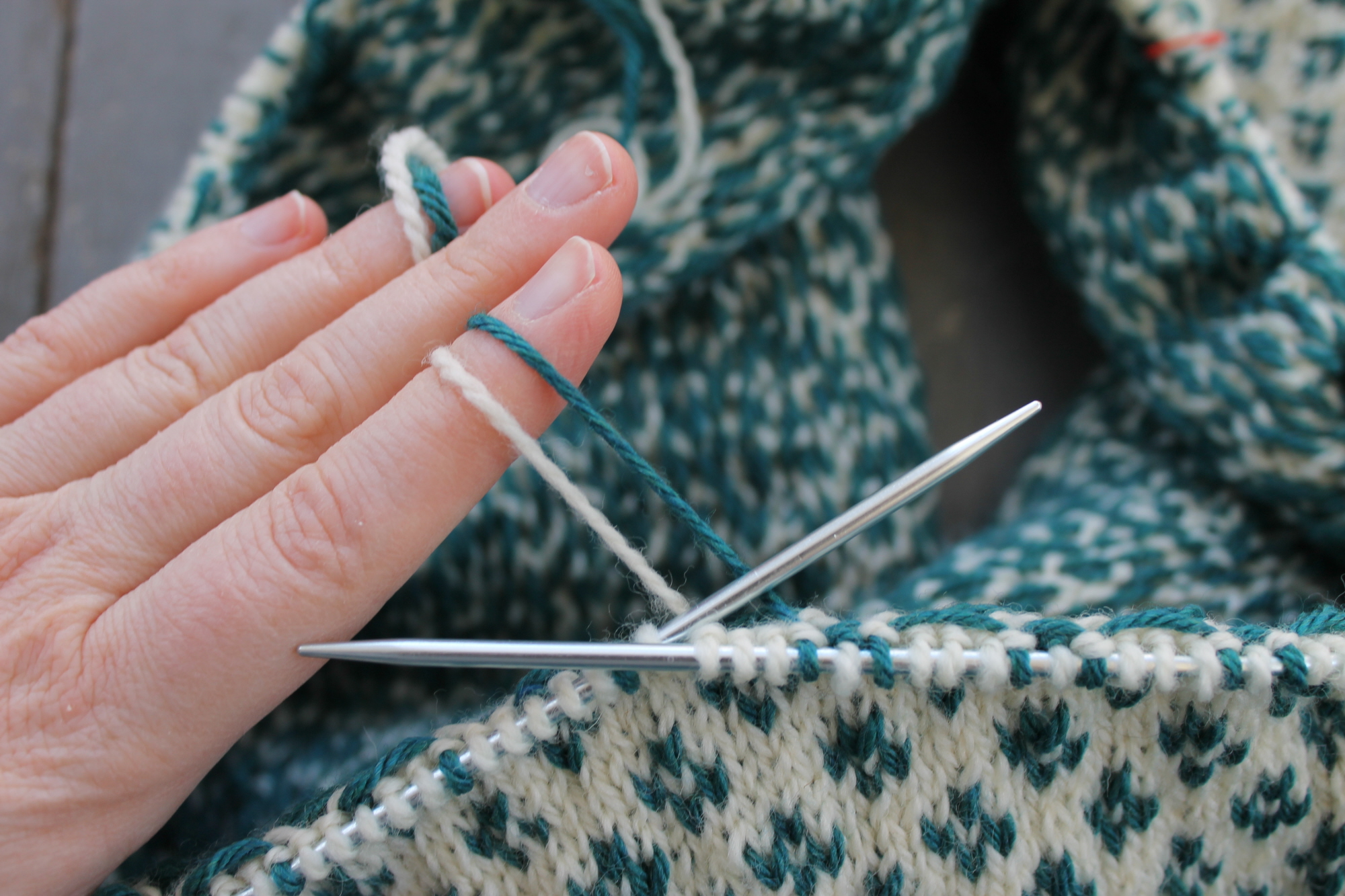 Holding both yarns in the left hand for stranded knitting