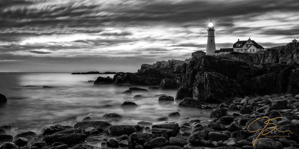 Portland Head Light captured at sunrise. In black and white using a long exposure