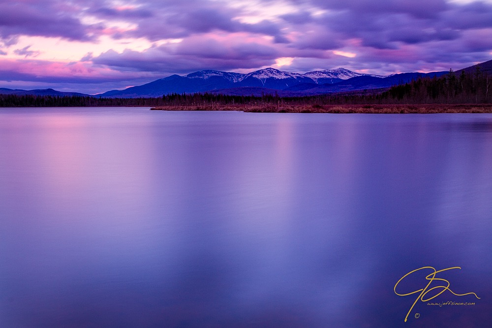 Long exposure photo of Cherry Pond and the Presidential Range of New Hampshire