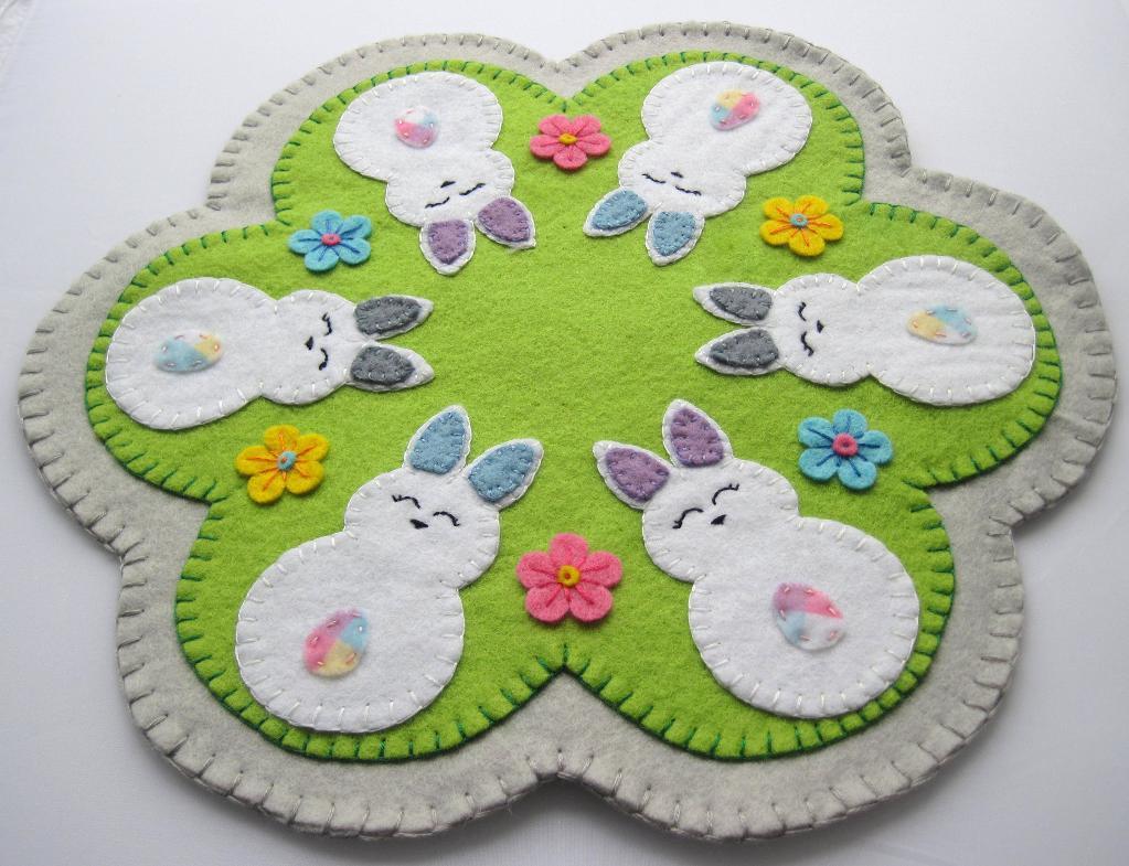 hand embroidered easter themed penny rug made of felt featuring bunnies