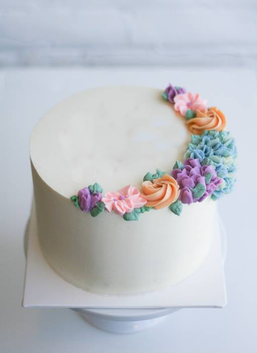 Smooth Buttercream And Piped Flowers by Erica O'Brien | Erin Gardner | Bluprint