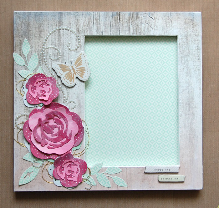 Adhere flowers/embellishments to frame