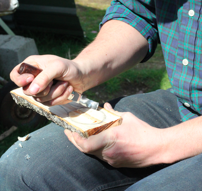 Using a hook knife to carve out the bowl of the spoon method one