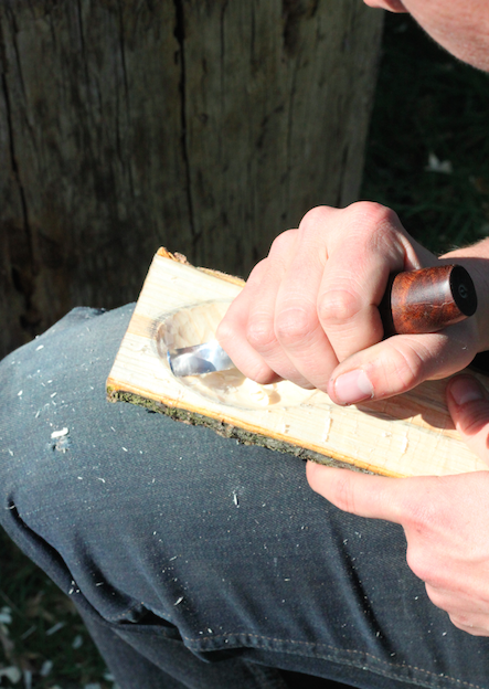 Using a hook knife to carve out the bowl of the spoon method four