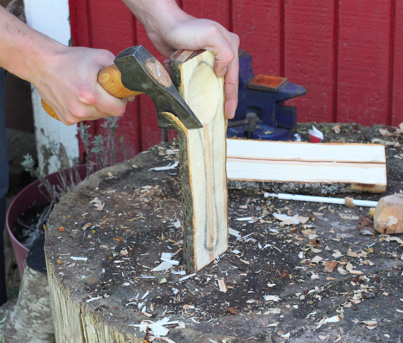 first cut of rough shaping the spoon with a hatchet