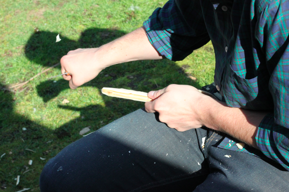 refining the base of the handle using a carving knife