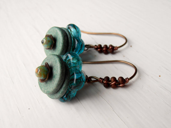 Earrings embellished with peanut seed beads.