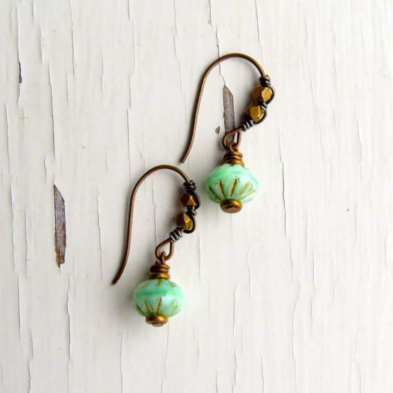 Earrings with earwires embellished with brass beads and contrasting antique silver wire.