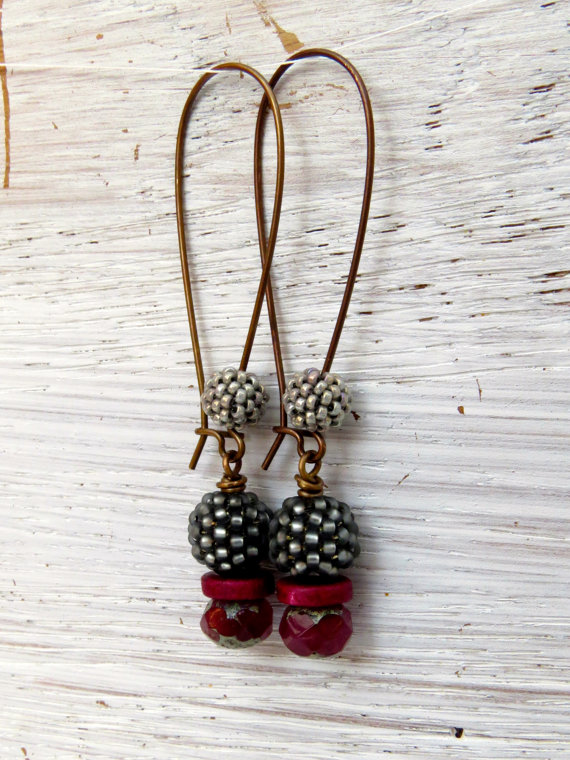 Earrings with earwires embellished with beads coordinating with the main body of the earrings.