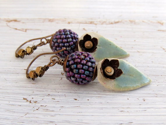 Earrings with earwires embellished with mid-sized brass faceted beads.