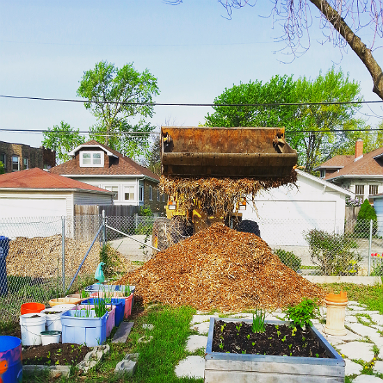 Mulch being delivered to a community garden