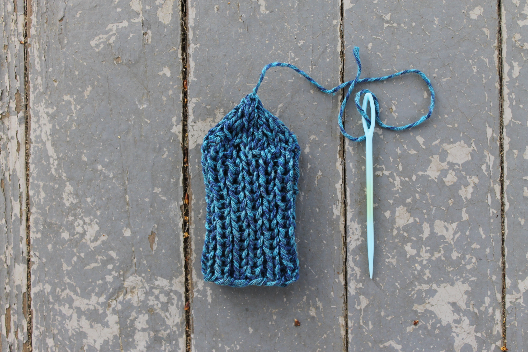 Chair leg sock with yarn needle