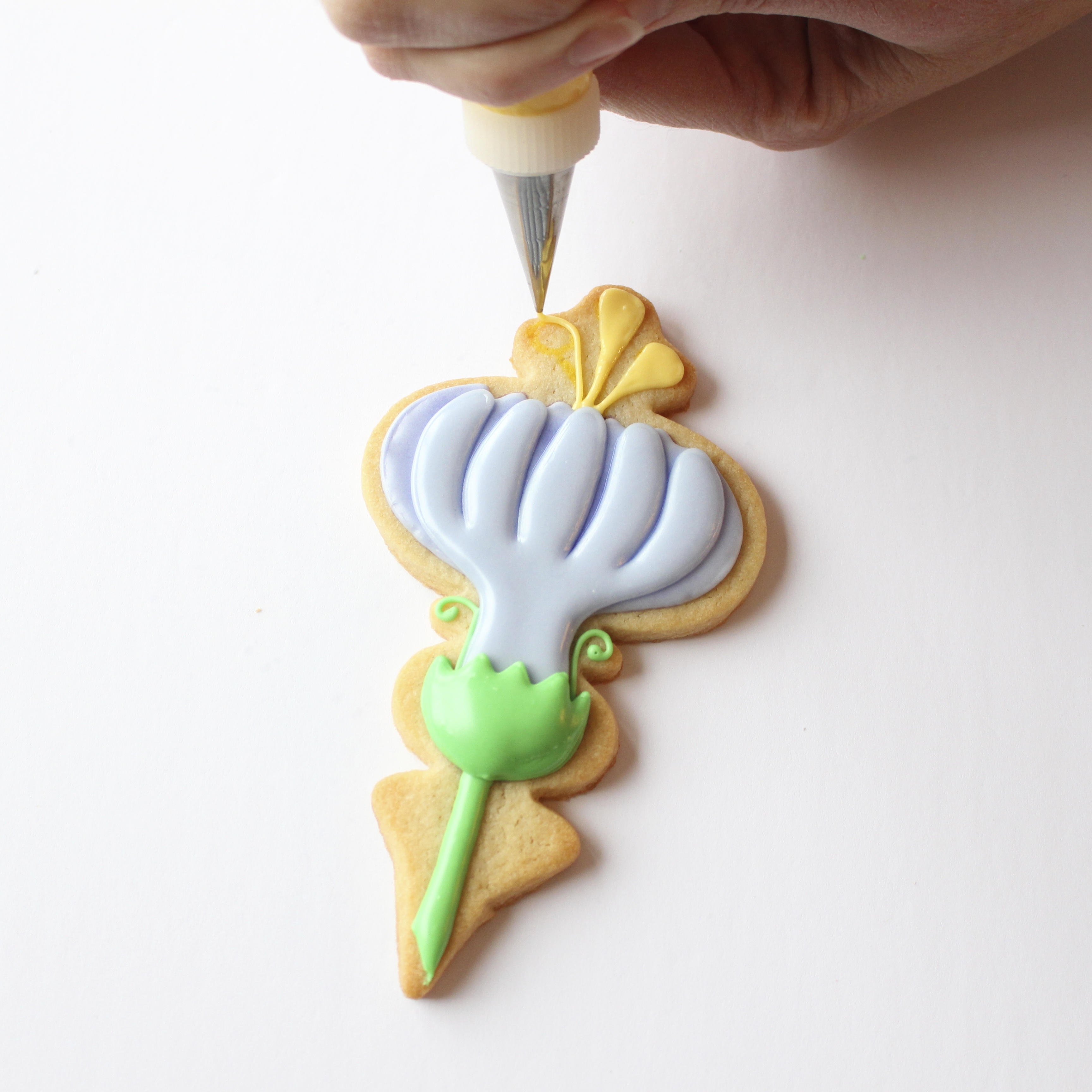 outlining and topping the top of the flower detail