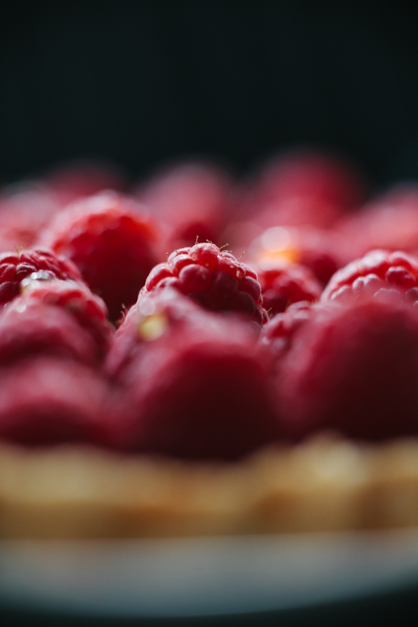 close up photo of bowl of raspberries