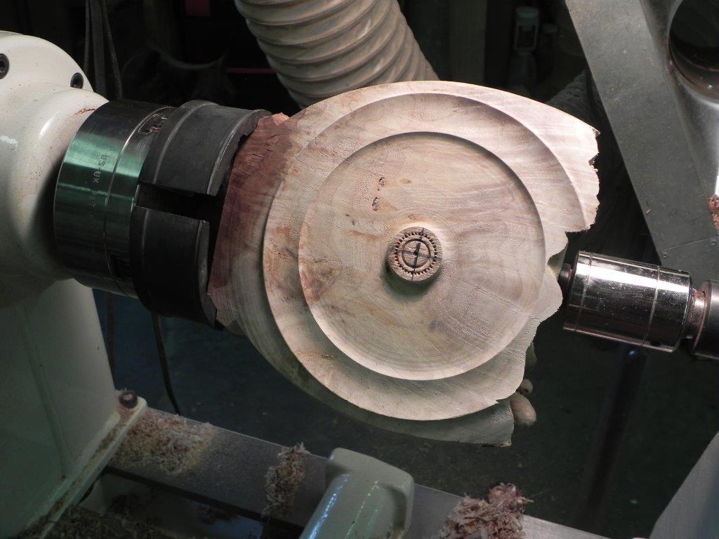 scrap wood with cuts mounted in the chuck
