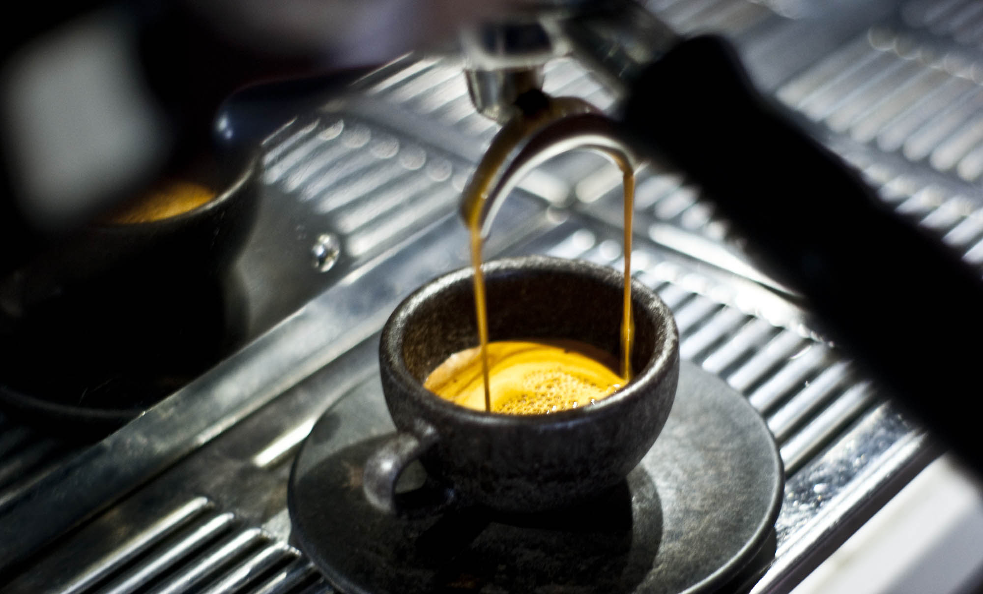 coffee cup made from coffee grounds holding espresso