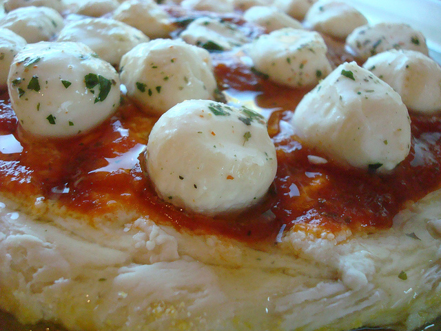This cheesy pizza made on no knead, no rise pizza dough is ready for baking!