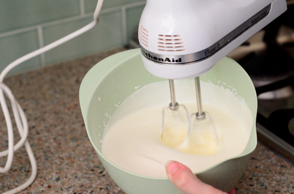 The heavy cream is whipped to stiff peaks.