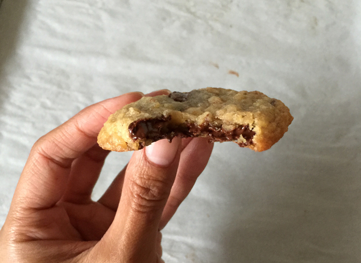 chocolate potato chip cookie with bite taken