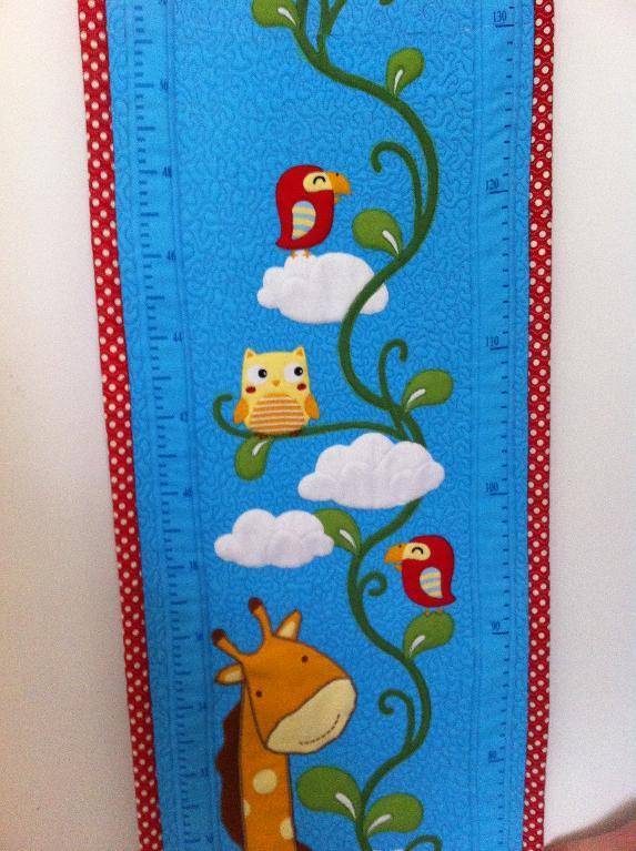 Animals on a quilted growth chart