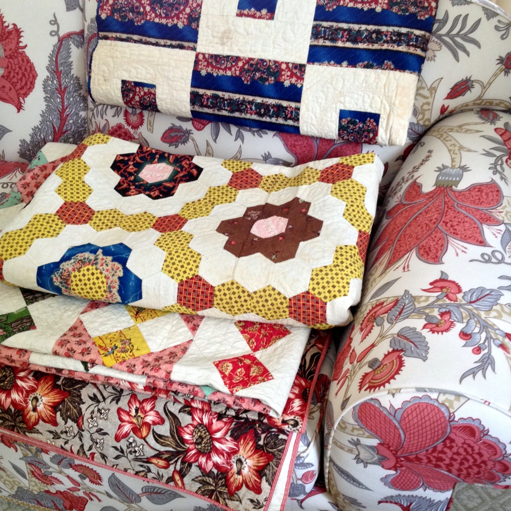 19th century quilts kept on a 21st century sofa