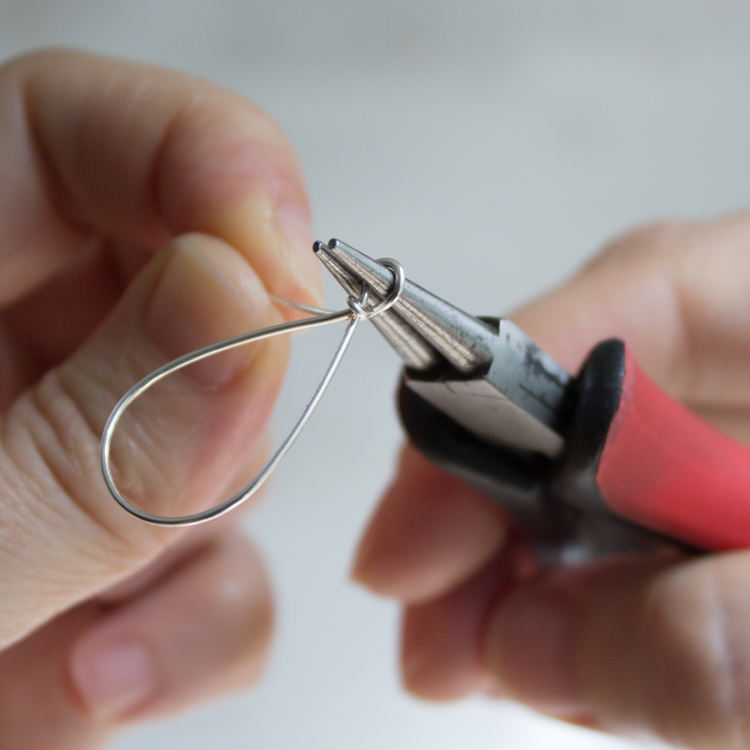 Continue pulling the wire down