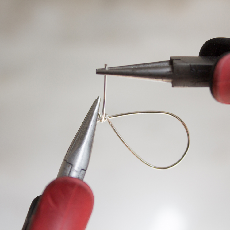 Continue bending this wire up and around the earring