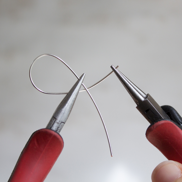 Grasp the shorter end of the wire
