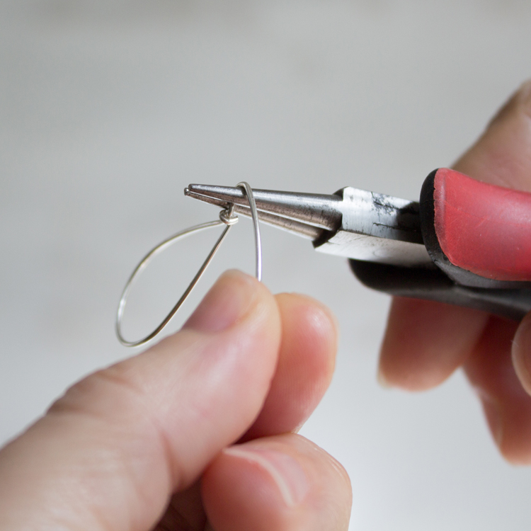 Bend the wire around your round-nose pliers